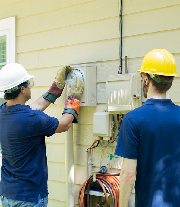 Two guys checking the HVAC, Plumbing, & Electrical Systems